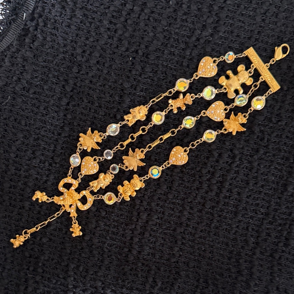 Kirk’s Folly: 4 strands teddy bear with wings, hearts with rhinestones bracelet